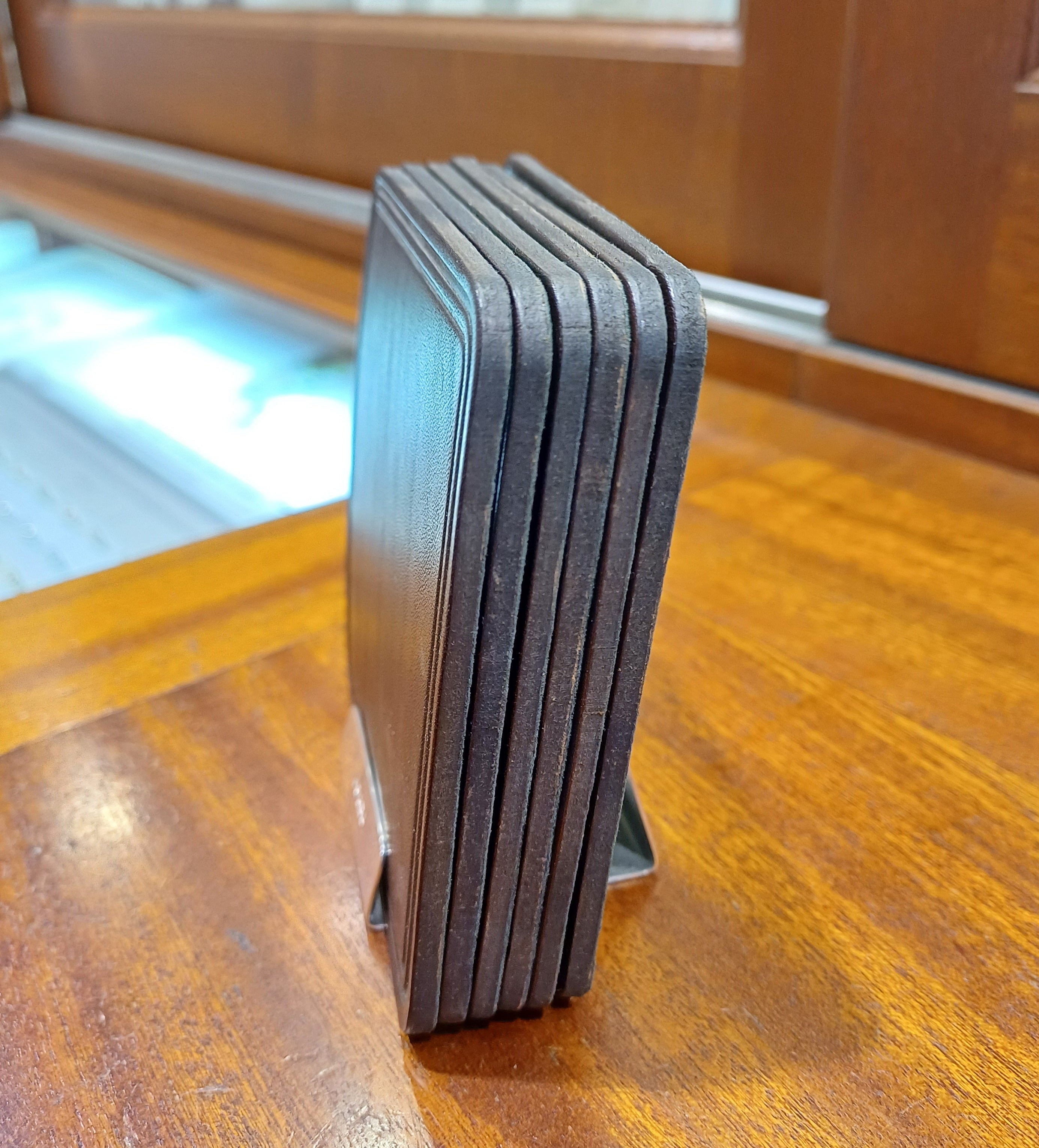 Pre Owned Set Of 6 Leather Coasters with a Sterling Silver Stand